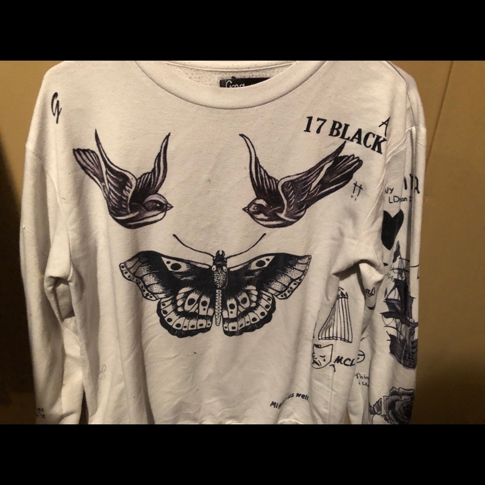 Well loved Harry Styles tattoo sweater